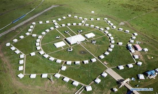 Aerial photo taken on Aug. 13, 2019 shows a tent scenic spot at Gaxiu Village of Gahai Township, Luqu County, Gannan Tibetan Autonomous Prefecture, northwest China's Gansu Province. In recent years, Gannan promoted culture and tourism industry to boost income of local people. (Xinhua/Chen Bin)